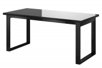 Čierny stôl so sklenenou doskou